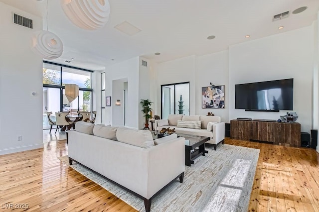 8525 W Verde Way, Las Vegas, NV 89149 - living area featuring light wood finished floors and expansive windows