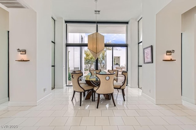 8525 W Verde Way, Las Vegas, NV 89149 - dining area with floor to ceiling windows and light tile patterned flooring