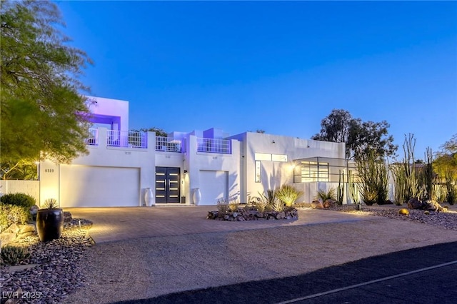 8525 W Verde Way, Las Vegas, NV 89149 - view of front facade with stucco siding, an attached garage, driveway, and a balcony