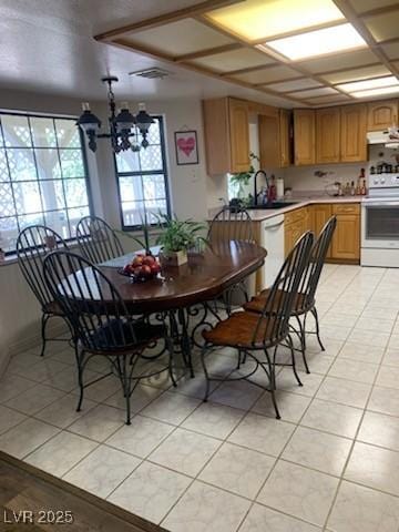 1385 Ringe Ln, Las Vegas, NV 89110 - dining room featuring light tile patterned floors and a chandelier