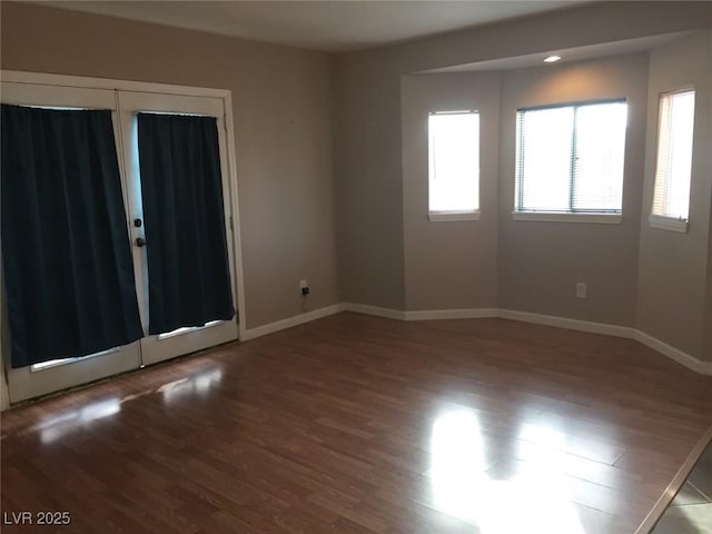 1385 Ringe Ln, Las Vegas, NV 89110 - empty room featuring wood finished floors and baseboards