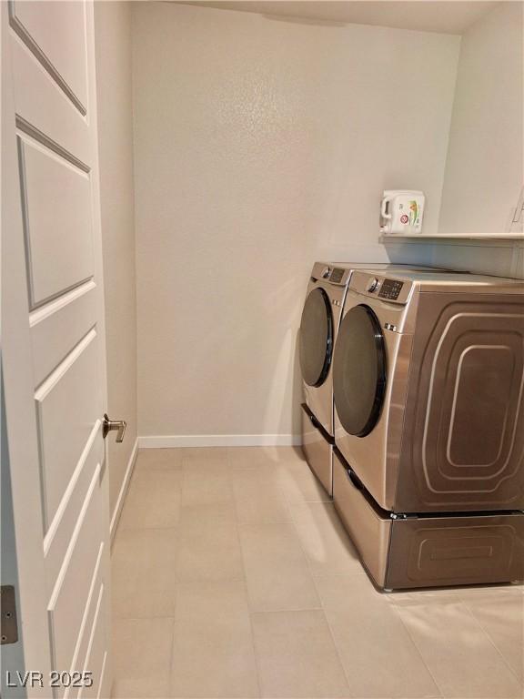 4286 E Cactus Canyon Dr, Pahrump, NV 89061 - laundry area with baseboards, laundry area, and separate washer and dryer
