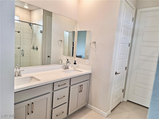 4286 E Cactus Canyon Dr, Pahrump, NV 89061 - full bathroom with tile patterned flooring, a sink, a shower stall, and double vanity