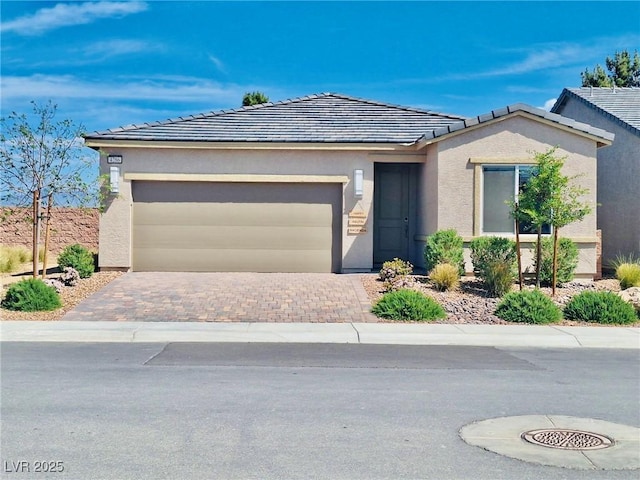4286 E Cactus Canyon Dr, Pahrump, NV 89061 - ranch-style house featuring stucco siding, driveway, a tiled roof, and a garage