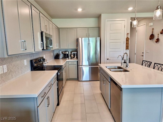 4286 E Cactus Canyon Dr, Pahrump, NV 89061 - kitchen with gray cabinets, a sink, light tile patterned flooring, tasteful backsplash, and appliances with stainless steel finishes