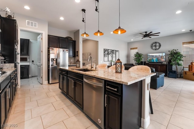 kitchen featuring a sink, visible vents, recessed lighting, a ceiling fan, and appliances with stainless steel finishes