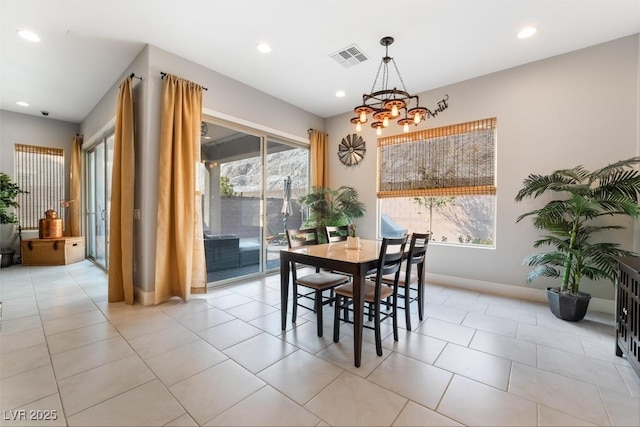dining area with light tile patterned floors, an inviting chandelier, baseboards, visible vents, and recessed lighting