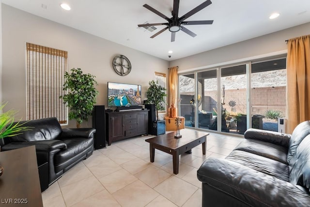 living room featuring ceiling fan, light tile patterned flooring, and recessed lighting