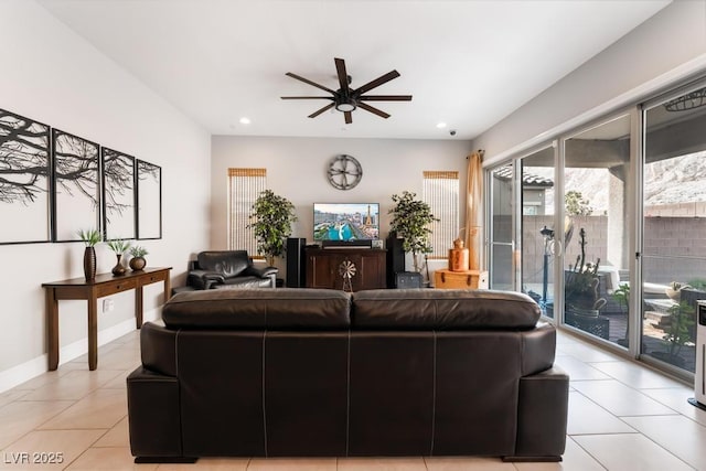 living area featuring recessed lighting, a ceiling fan, and light tile patterned floors