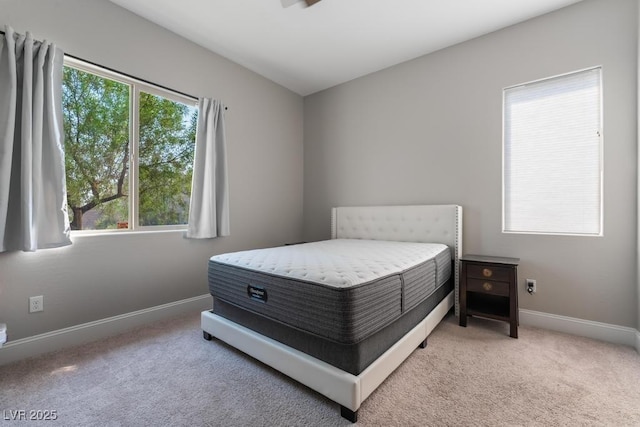 carpeted bedroom featuring baseboards