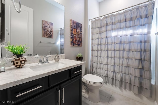 bathroom with shower / bath combo with shower curtain, toilet, vanity, and tile patterned floors