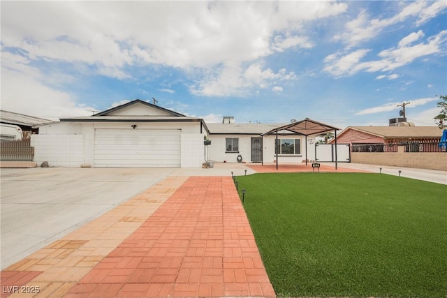 ranch-style house with a garage, driveway, a front yard, and fence