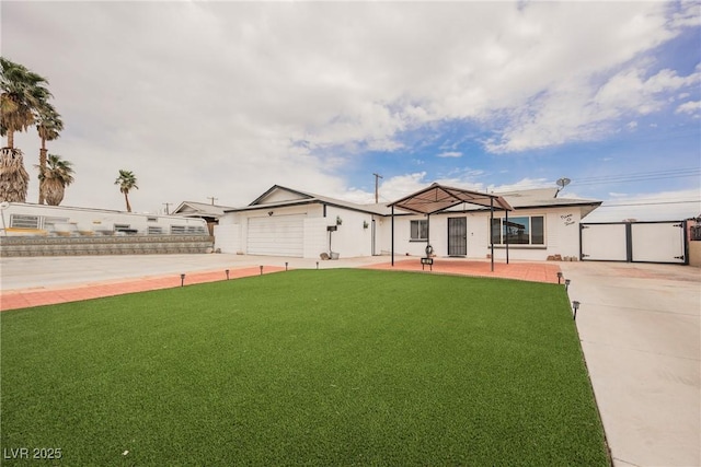 single story home featuring fence, driveway, a front yard, and a garage
