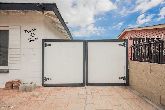 view of gate with fence