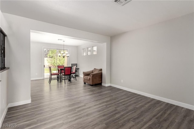 9604 Windom Point Ave, Las Vegas, NV 89129 - dining area with a chandelier, dark wood-type flooring, and baseboards