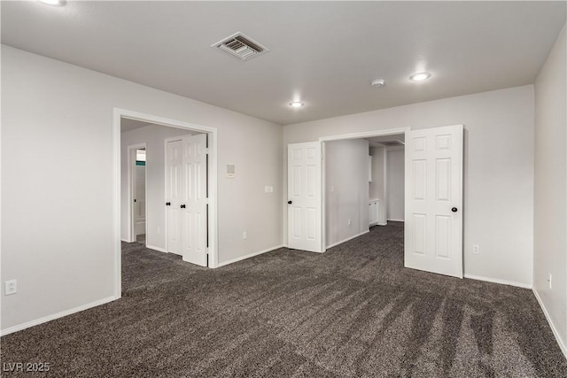 9604 Windom Point Ave, Las Vegas, NV 89129 - unfurnished bedroom with dark colored carpet, baseboards, and recessed lighting