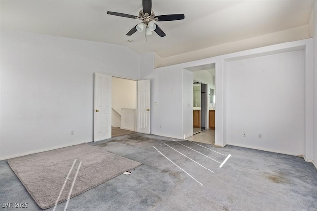 unfurnished bedroom featuring vaulted ceiling, baseboards, carpet, ceiling fan, and connected bathroom
