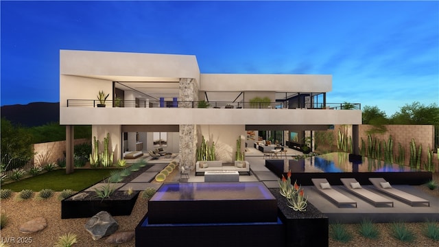 607 Grand Rim Dr, Henderson, NV 89012 - back of house with a balcony, outdoor lounge area, a patio, and stucco siding