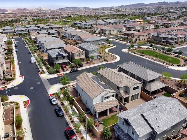 drone / aerial view featuring a residential view and a mountain view