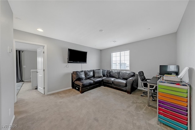 living room featuring baseboards and light carpet