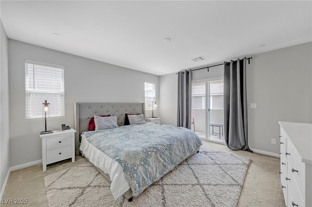 bedroom with light carpet, access to outside, visible vents, and baseboards
