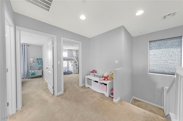 recreation room with recessed lighting, light carpet, visible vents, and baseboards