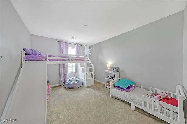 bedroom with carpet floors, visible vents, and baseboards