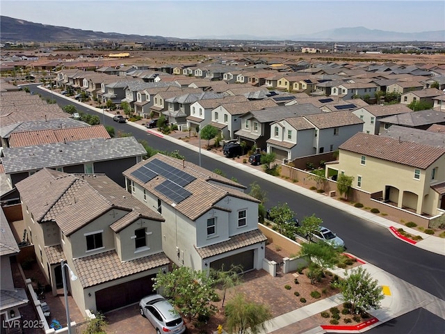 drone / aerial view featuring a mountain view and a residential view