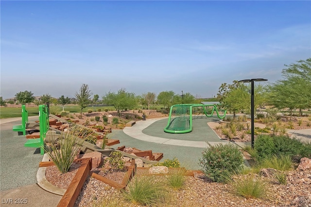 view of property's community featuring playground community