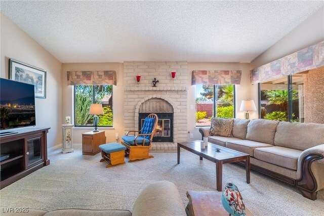 carpeted living room featuring a textured ceiling and a fireplace