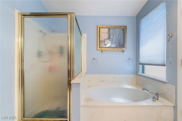 full bath featuring a stall shower and a garden tub