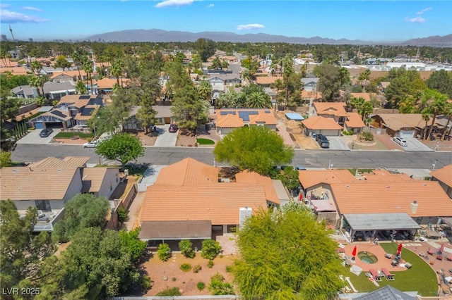 aerial perspective of suburban area featuring a mountain backdrop