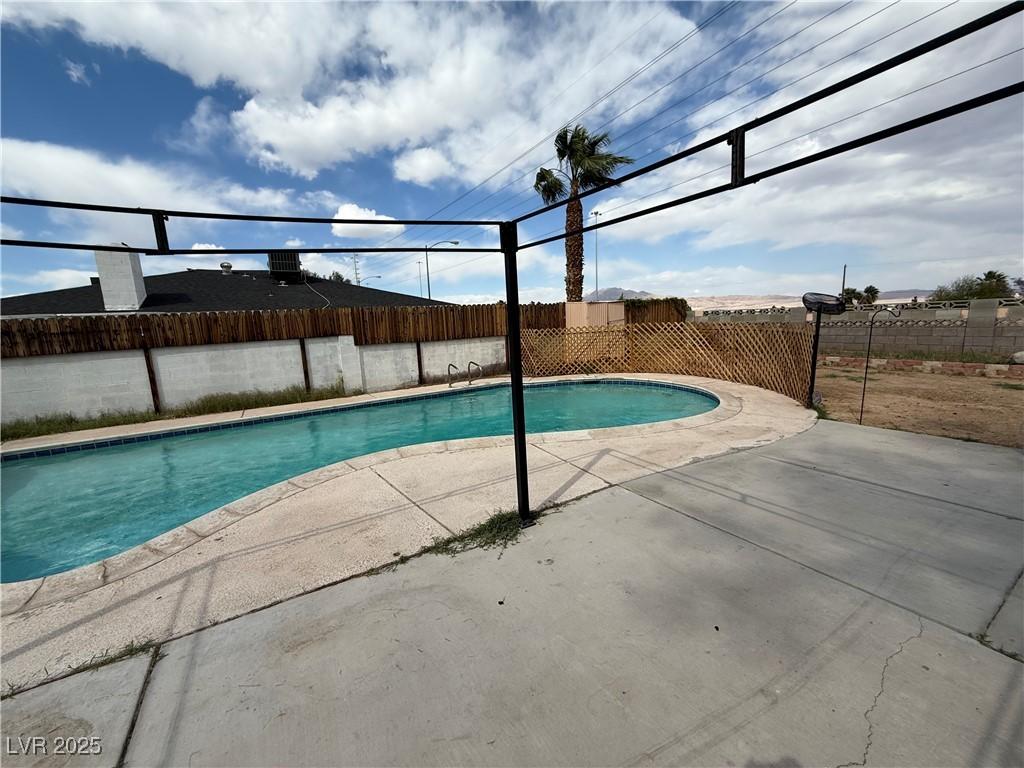 view of swimming pool featuring a fenced in pool, a patio area, and a fenced backyard