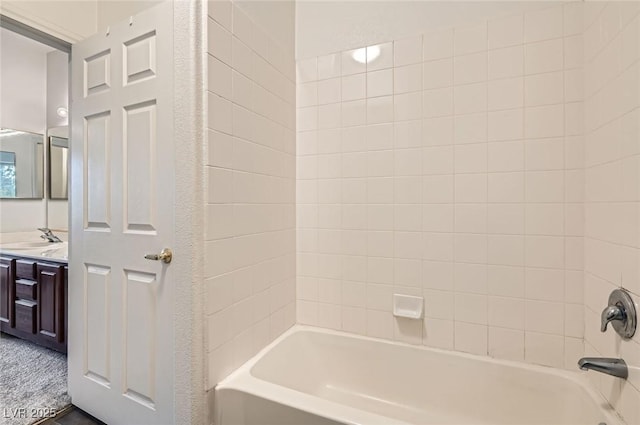 bathroom featuring shower / bath combination and vanity
