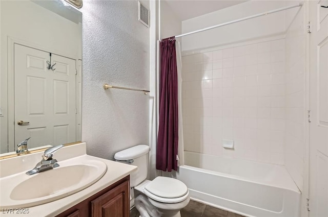 full bath with toilet, visible vents, shower / bath combo with shower curtain, a textured wall, and vanity