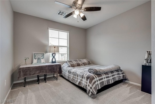 bedroom with ceiling fan, carpet floors, visible vents, and baseboards