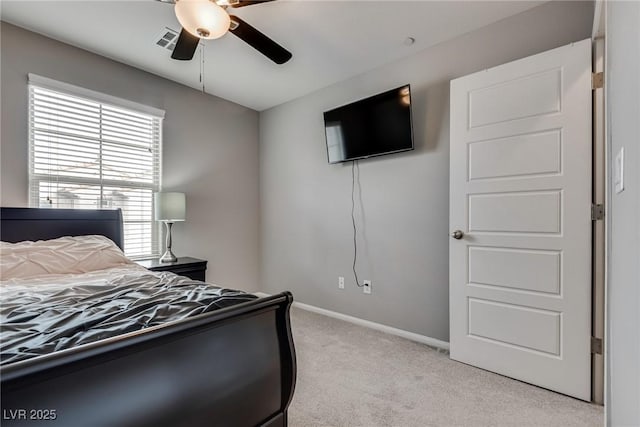 bedroom featuring light colored carpet, baseboards, a ceiling fan, and visible vents