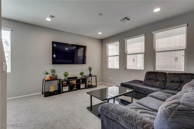 carpeted living room featuring recessed lighting, baseboards, visible vents, and plenty of natural light