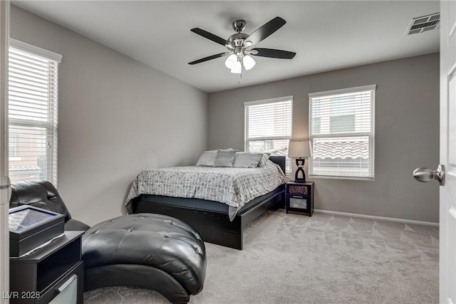 bedroom featuring visible vents, carpet flooring, baseboards, and a ceiling fan