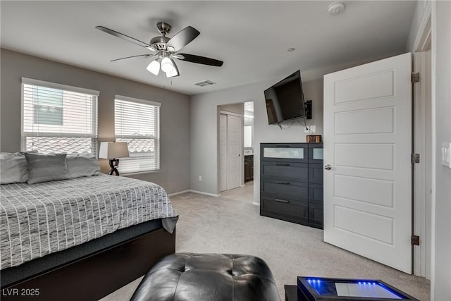 bedroom with baseboards, visible vents, a ceiling fan, and light colored carpet