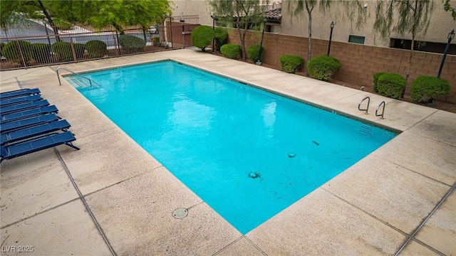 pool featuring fence