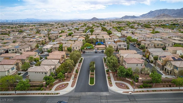 birds eye view of property featuring a mountain view and a residential view