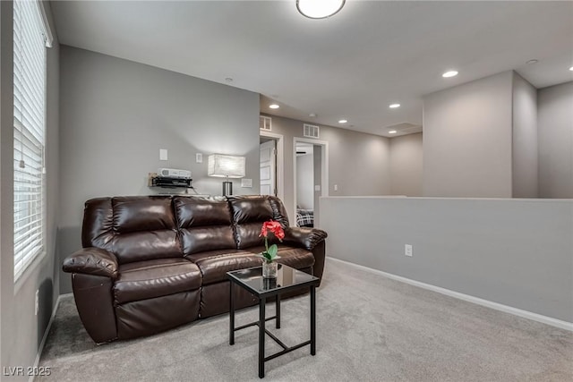 living room with a wealth of natural light, baseboards, carpet floors, and recessed lighting