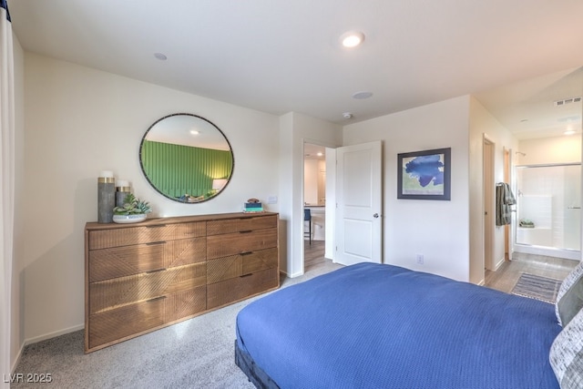 bedroom with connected bathroom, baseboards, visible vents, and recessed lighting
