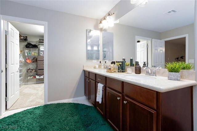 5409 Holding Ave, Las Vegas, NV 89139 - full bath featuring carpet flooring, a sink, visible vents, and double vanity