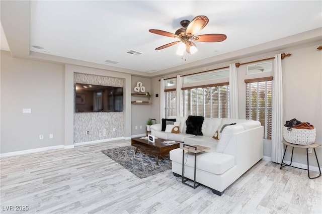 5409 Holding Ave, Las Vegas, NV 89139 - living area featuring wood finished floors, visible vents, baseboards, and ceiling fan