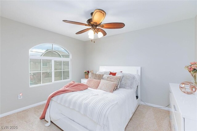 5409 Holding Ave, Las Vegas, NV 89139 - bedroom with ceiling fan, light carpet, and baseboards