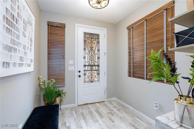 5409 Holding Ave, Las Vegas, NV 89139 - entryway featuring baseboards and wood finished floors