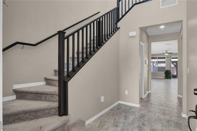 10976 Bluebell Basin Rd, Las Vegas, NV 89179 - stairs with a ceiling fan and baseboards