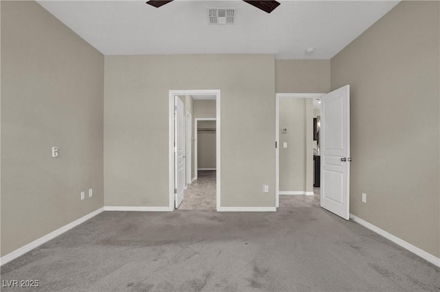10976 Bluebell Basin Rd, Las Vegas, NV 89179 - unfurnished bedroom featuring carpet floors, a spacious closet, baseboards, ceiling fan, and a closet